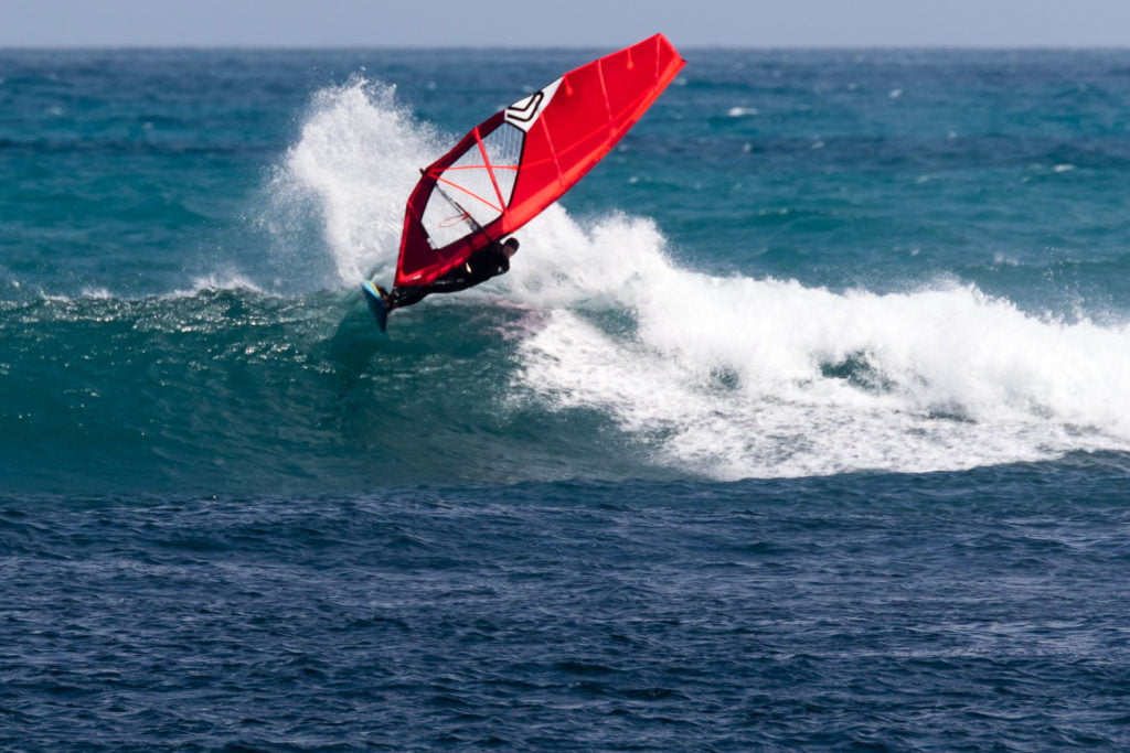 Windsurfer on a wave in Taranaki