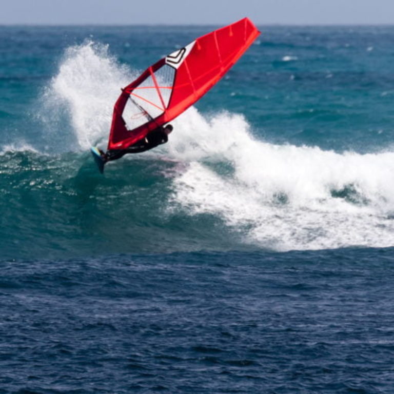 Windsurfer on a wave in Taranaki