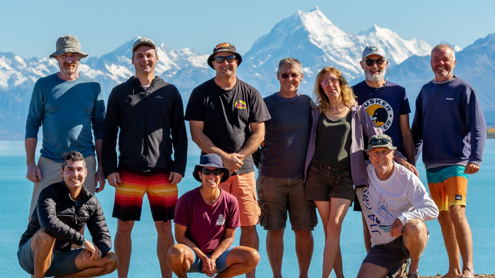 Water Nomads Surfari Trip guests pose in front of Lake Pukaki and Aoraki Mt Cook