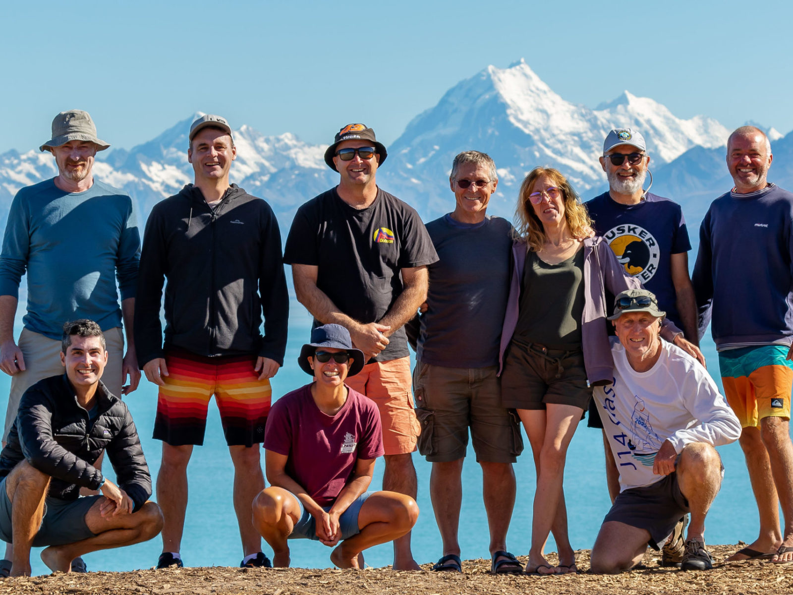 Water Nomads Surfari Trip guests pose in front of Lake Pukaki and Aoraki Mt Cook